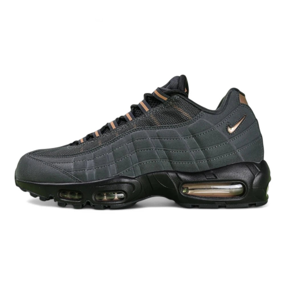 Central Cee x Air Max 95 Live Yours - Heel Close Up Detail Showing Copper Nike Air Branding and Copper Heel Counter on Green Background