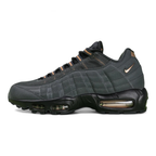 Central Cee x Air Max 95 Live Yours - Heel Close Up Detail Showing Copper Nike Air Branding and Copper Heel Counter on Green Background