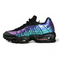 Air Max 95 TT Iridescent - Lateral Toe Box Close Up on Green Background Showing Black Leather Upper and Iridescent Purple Blue Chameleon Spine Panel