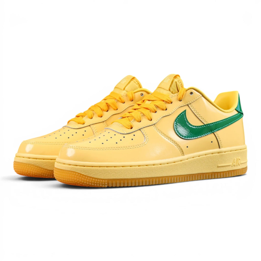 Air Force 1 Low Patent Leather Topaz Gold - Pair Top Down View Dark Background