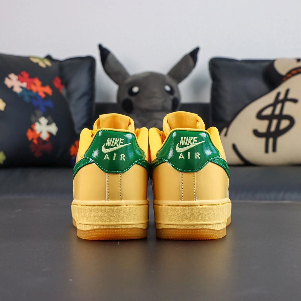 Air Force 1 Low Patent Leather Topaz Gold - Pair Pikachu Background Side View