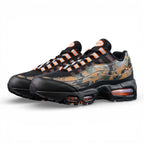 Air Max 95 OG Orange Camo 2025 - Pair with Outsole Displayed on Sofa