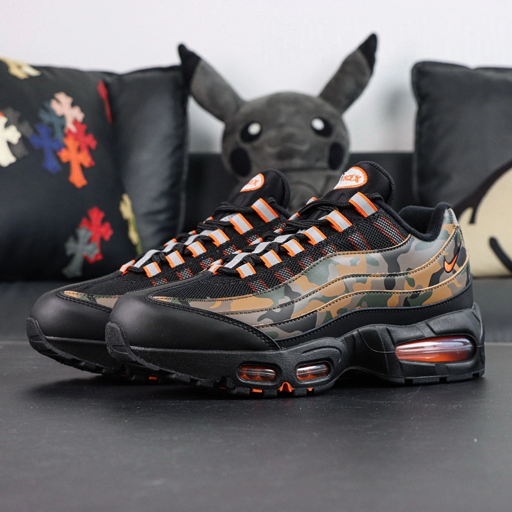Air Max 95 OG Orange Camo 2025 - Lateral Side View on Sofa