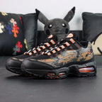 Air Max 95 OG Orange Camo 2025 - Lateral Side View on Sofa
