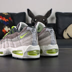 Air Max 95 OG Reverse Neon 2025 - Three Quarter Front View on Sofa with Pikachu