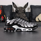 Air Max Plus Black Metallic Silver - Lateral Side View with Pikachu on Sofa