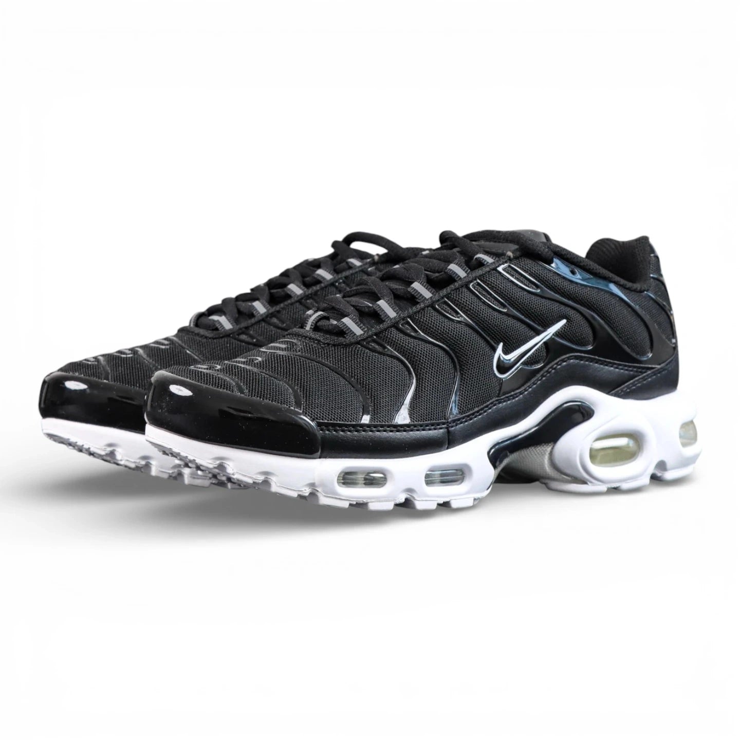 Air Max Plus Black White - Pair Three Quarter View on White Background