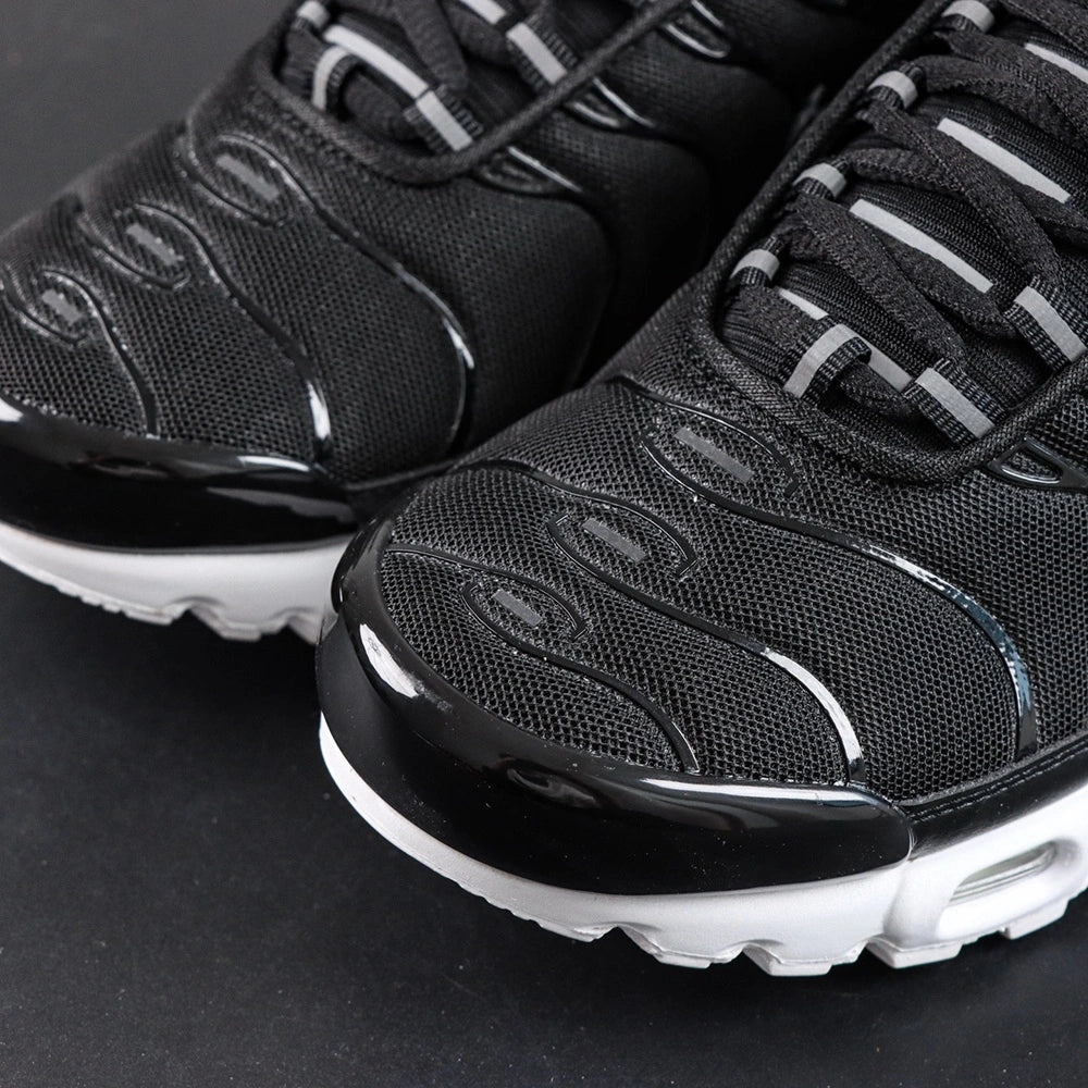 Air Max Plus Black White - Three Quarter Lateral View with Pikachu on Sofa