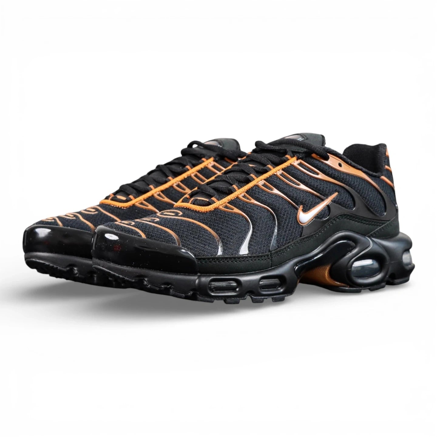 Air Max Plus Dark Obsidian Monarch 2024 - Pair with Outsole Displayed and Pikachu on Sofa