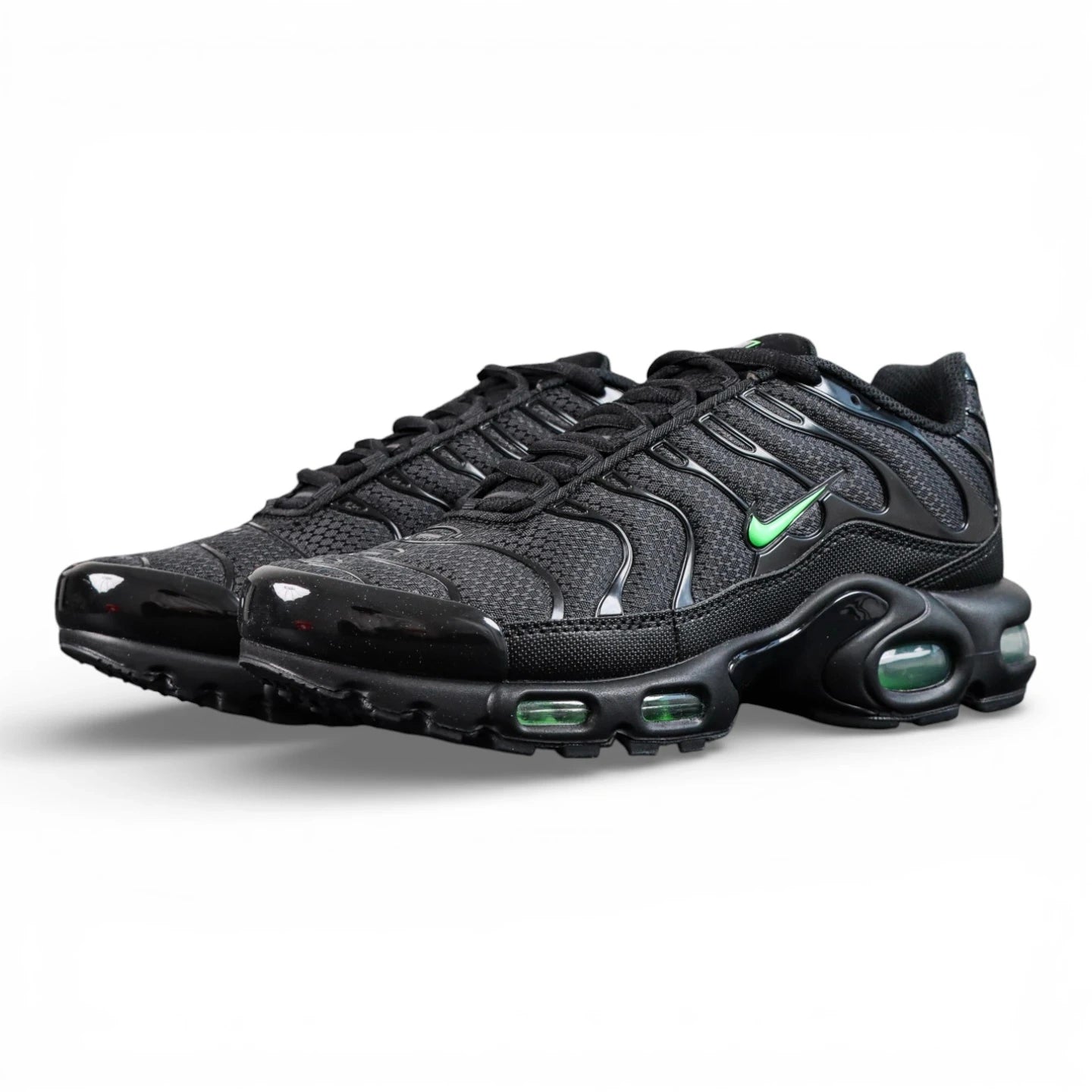 Air Max Plus Green Strike - Three Quarter Lateral View with Pikachu on Sofa