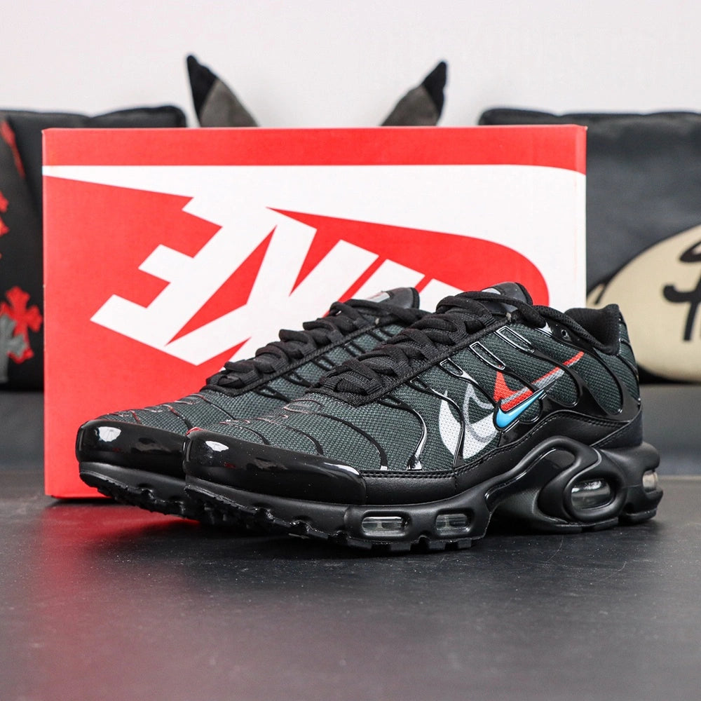 Air Max Plus Multi Swoosh Black Bright Crimson 2023 - Three Quarter Lateral View with Pikachu on Sofa