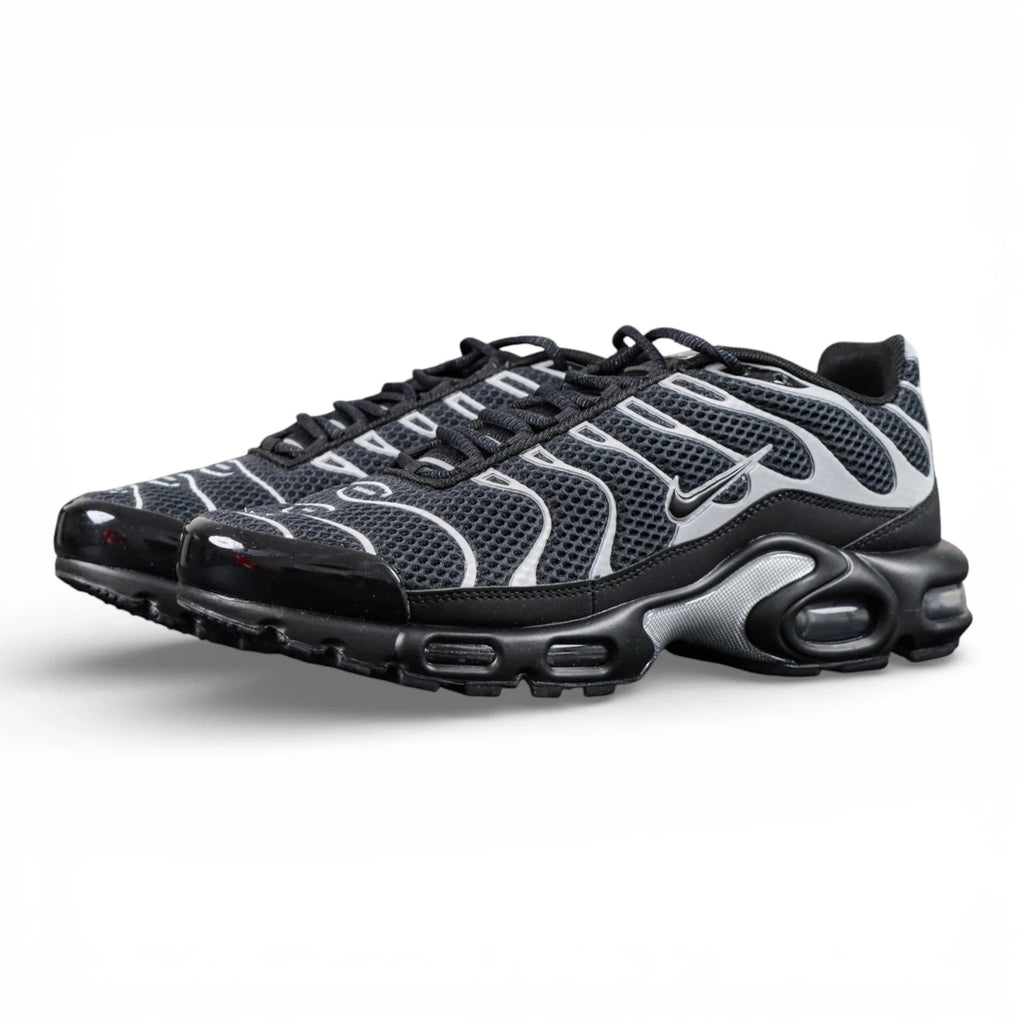 Air Max Plus Premium Black Metallic Silver 2024 - Pair Top Down View on Dark Background Showing Reflective Silver Wave Panels