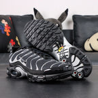 Air Max Plus Premium Black Metallic Silver 2024 - Pair Three Quarter View on Dark Background