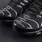 Air Max Plus SE Black Chrome Silver 2024 - Pair Three Quarter View on Dark Background