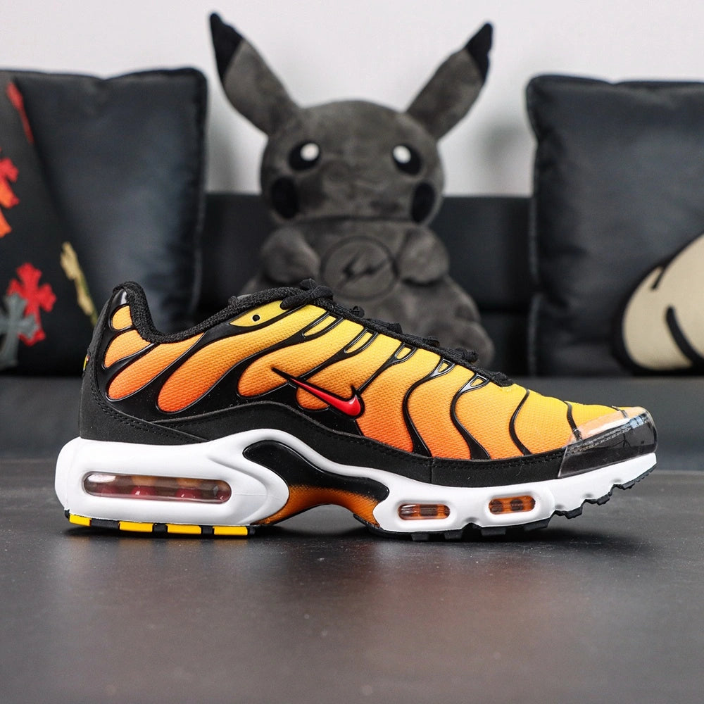 Air Max Plus Sunset 2024 - Toe Box Close Up Detail Showing Yellow to Orange Gradient Wave Panels and Translucent Toe Cap on Dark Background