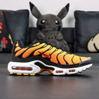 Air Max Plus Sunset 2024 - Toe Box Close Up Detail Showing Yellow to Orange Gradient Wave Panels and Translucent Toe Cap on Dark Background