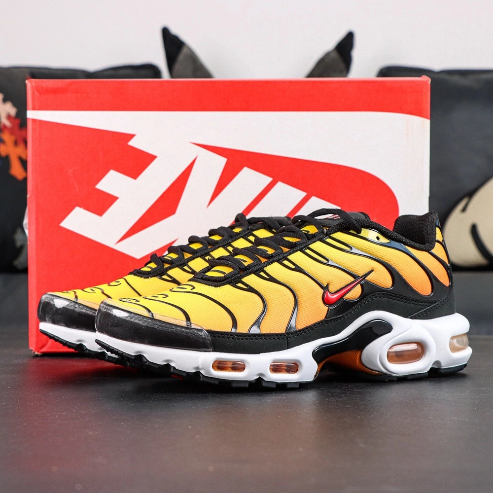 Air Max Plus Sunset 2024 - Three Quarter Heel View with Pikachu on Sofa Showing Orange Air Units