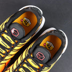 Air Max Plus Sunset 2024 - Pair Top Down View on Dark Background Showing Full Gradient Upper and Red Swoosh