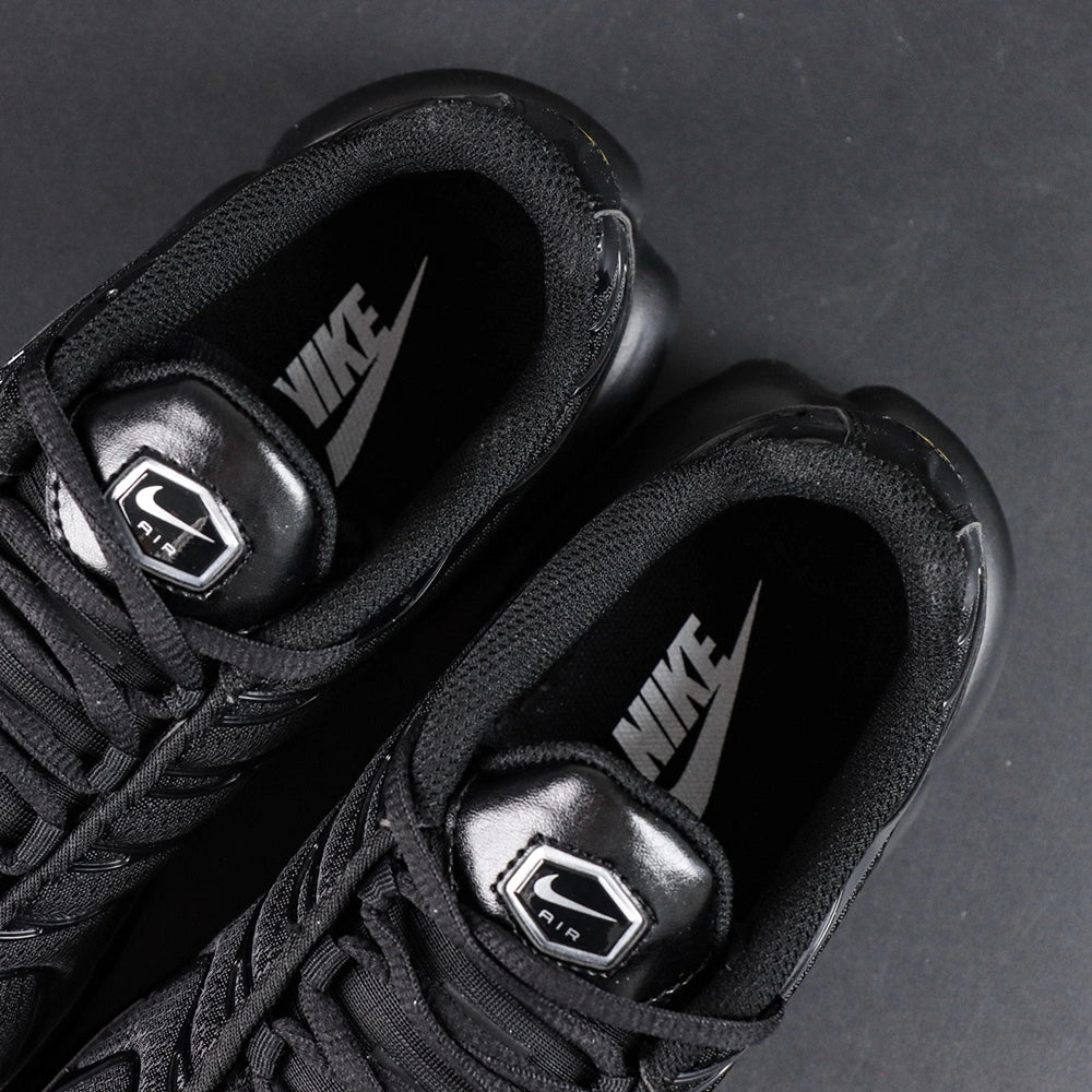 Air Max Plus Triple Black 2017 - Lateral Side View with Red Heel Air Unit Glow and Pikachu on Sofa