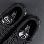 Air Max Plus Triple Black 2017 - Lateral Side View with Red Heel Air Unit Glow and Pikachu on Sofa