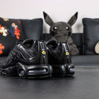Air Max Plus Triple Black 2017 - Lateral Side View with Nike Box and Pikachu on Sofa