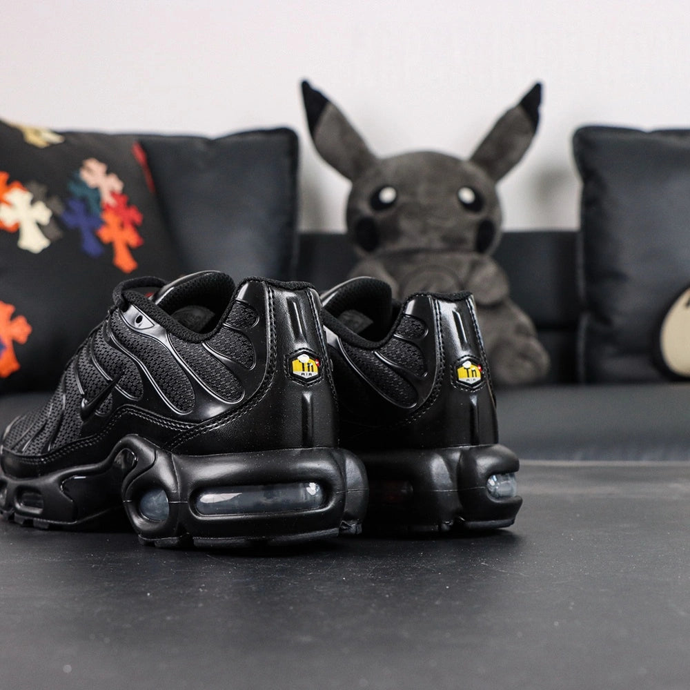 Air Max Plus Triple Black 2017 - Lateral Side View with Nike Box and Pikachu on Sofa