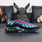 Air Max Plus Unity - Pair Top Down View on Dark Background Showing Full Rainbow Gradient Upper and White Swoosh