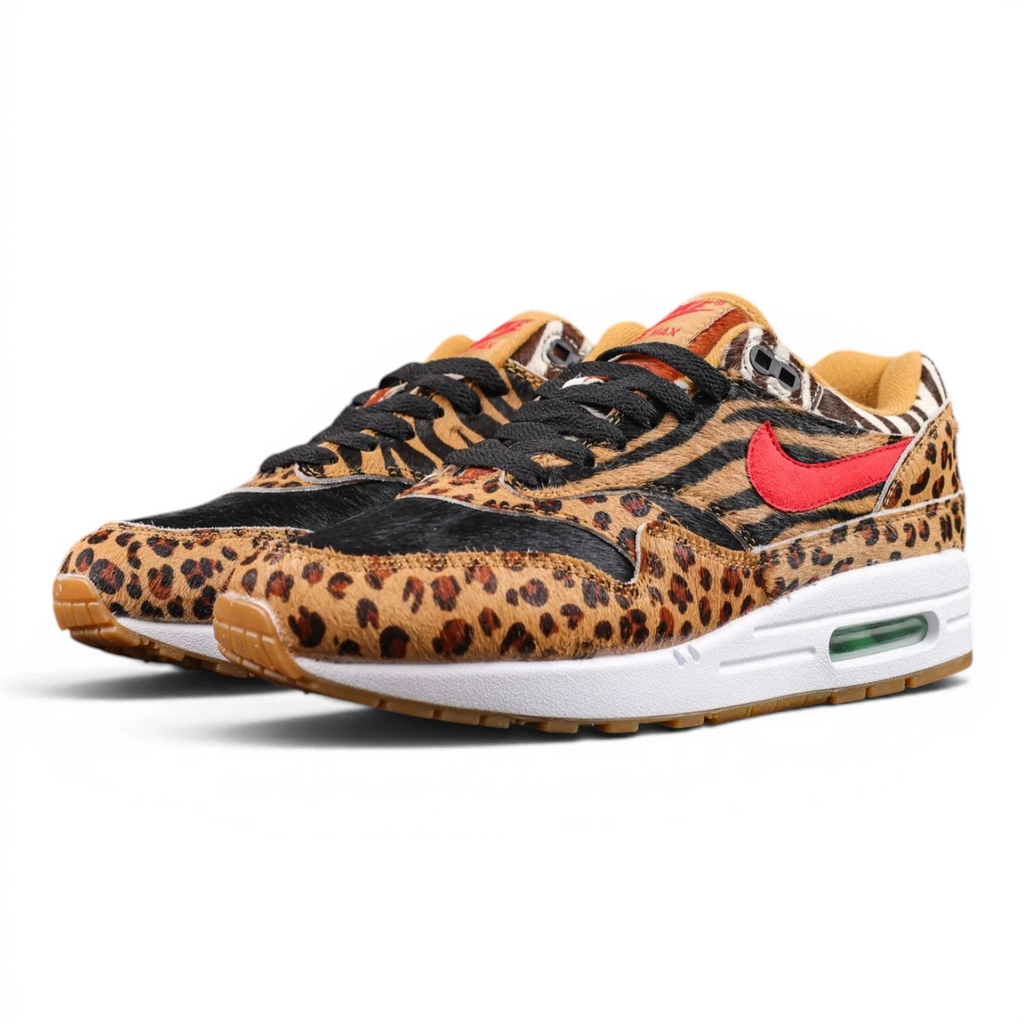 Atmos x Air Max 1 DLX Animal Pack 2018 - Pair Top Down View on Dark Background Showing All Four Animal Print Panels and Red Pony Hair Swoosh