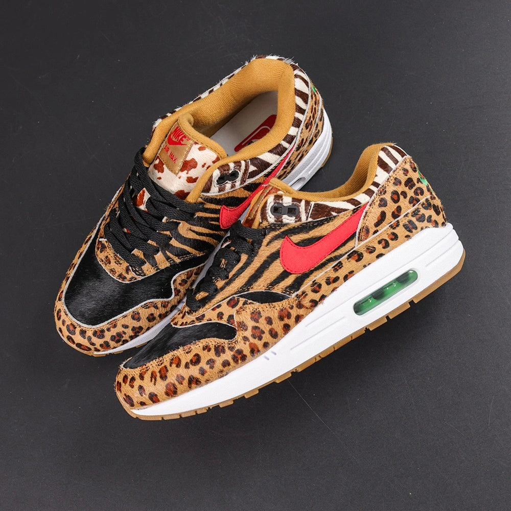 Atmos x Air Max 1 DLX Animal Pack 2018 - Heel Pair Rear View Showing Green Nike Air Embroidery on Leopard Print Heel Counter and Green Air Unit with Pikachu on Sofa