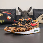 Atmos x Air Max 1 DLX Animal Pack 2018 - Outsole View Showing Gum Rubber Tread and Green Air Unit Window with Pikachu on Sofa