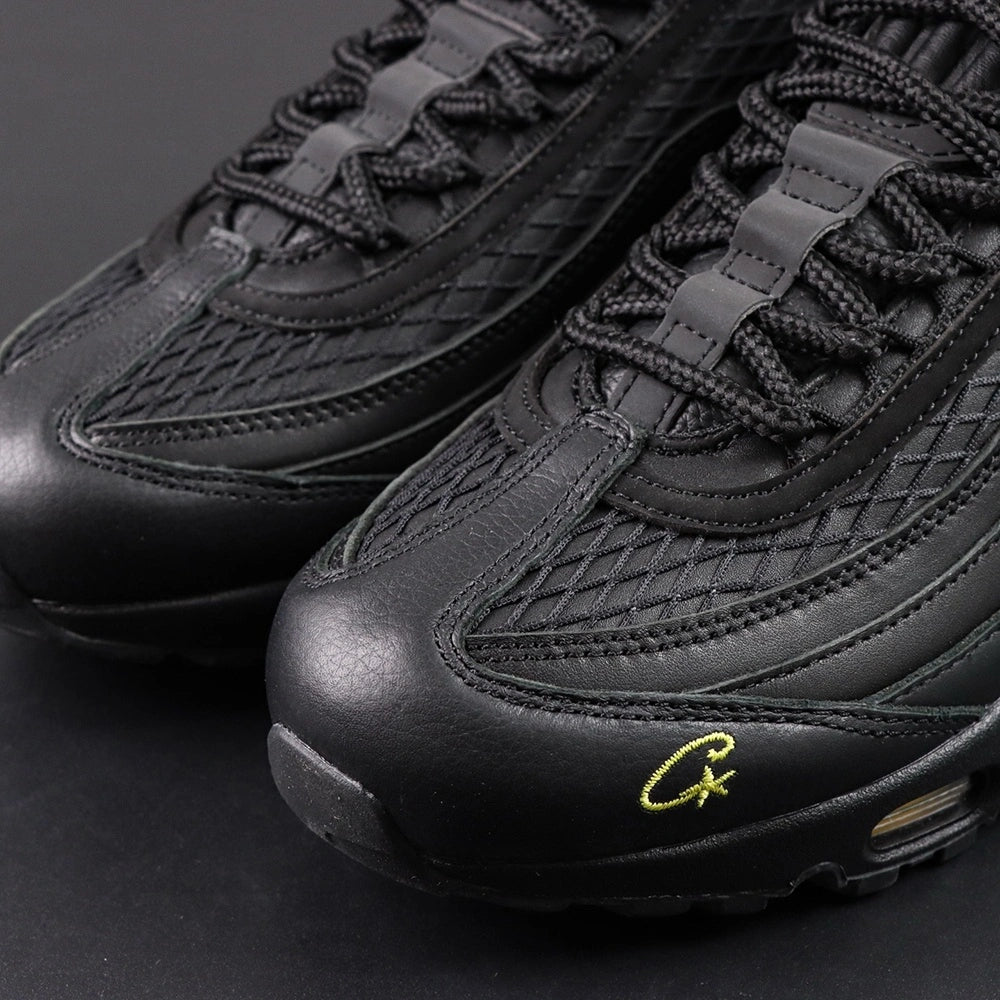 Corteiz x Air Max 95 SP Honey Blacks - Outsole View Showing Corteiz Star Lightning Bolt Graphic Through Honey Amber Translucent Heel Air Unit on Dark Background