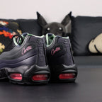 Corteiz x Air Max 95 SP Rules the World Pink Beam - Outsole View Showing Black Rubber Tread and Camo Insole Visible Through Pink Translucent Heel Air Unit on Dark Background