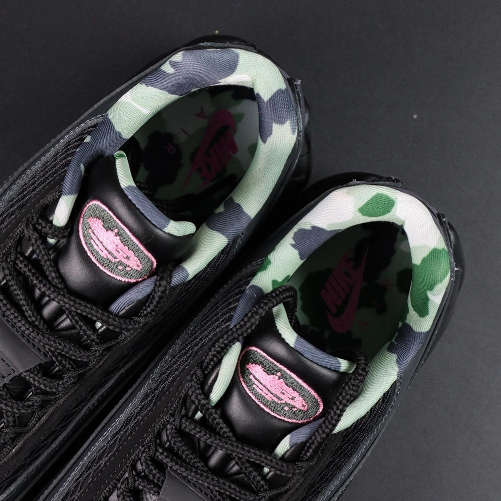 Corteiz x Air Max 95 SP Rules the World Pink Beam - Toe Box Close Up Showing Diamond Quilted Black Leather and Hot Pink Corteiz Script on Midsole on Dark Background