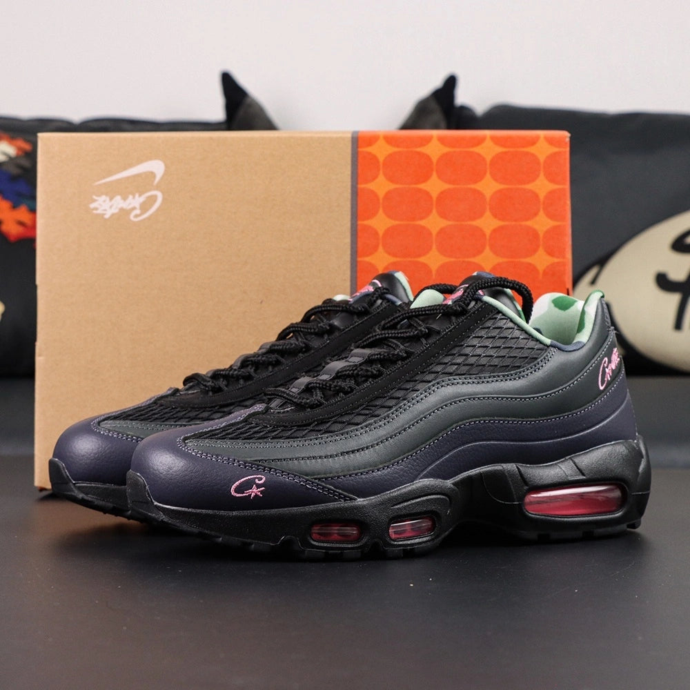 Corteiz x Air Max 95 SP Rules the World Pink Beam - Heel Pair Rear View Showing Tonal Nike Air Heel Counter 916079-916 Style Code and Hot Pink Corteiz Script with Pikachu on Sofa