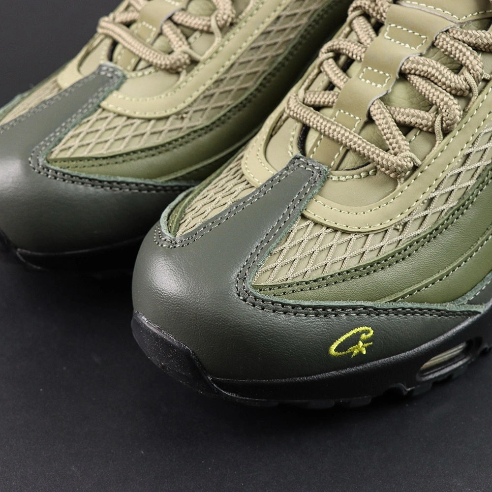 Corteiz x Air Max 95 SP Gutta Green - Pair Top Down View Showing Multi-Colour Military Camo Collar Lining Tongue Lining and Khaki Rope Laces on Dark Background