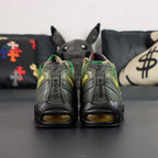 Corteiz x Air Max 95 SP Gutta Green - Heel Strap Close Up Showing Reversed 916079-916 Corteiz Founding Date Code Debossed in Tonal Olive and Volt Corteiz Script on Dark Background