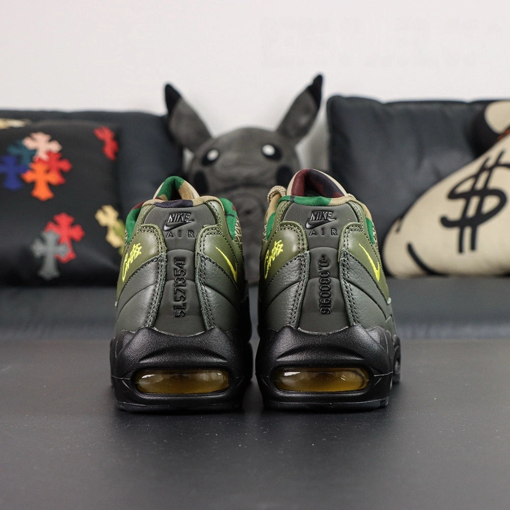 Corteiz x Air Max 95 SP Gutta Green - Heel Strap Close Up Showing Reversed 916079-916 Corteiz Founding Date Code Debossed in Tonal Olive and Volt Corteiz Script on Dark Background