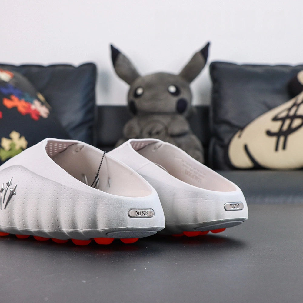 Drake NOCTA x Mind 001 Light Grey 2026 - Heel view pair
