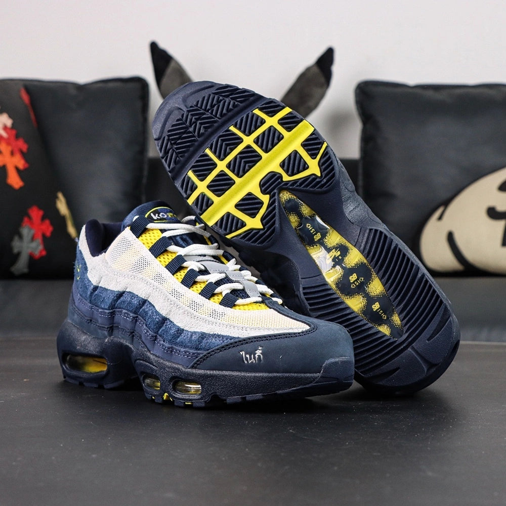 Eric Koston x Nike SB x Air Max 95 Obsidian Speed Yellow 2025 - Heel Pair Rear View with Pikachu on Sofa Showing Yellow Nike SB Air Heel Counter and Amber Air Units