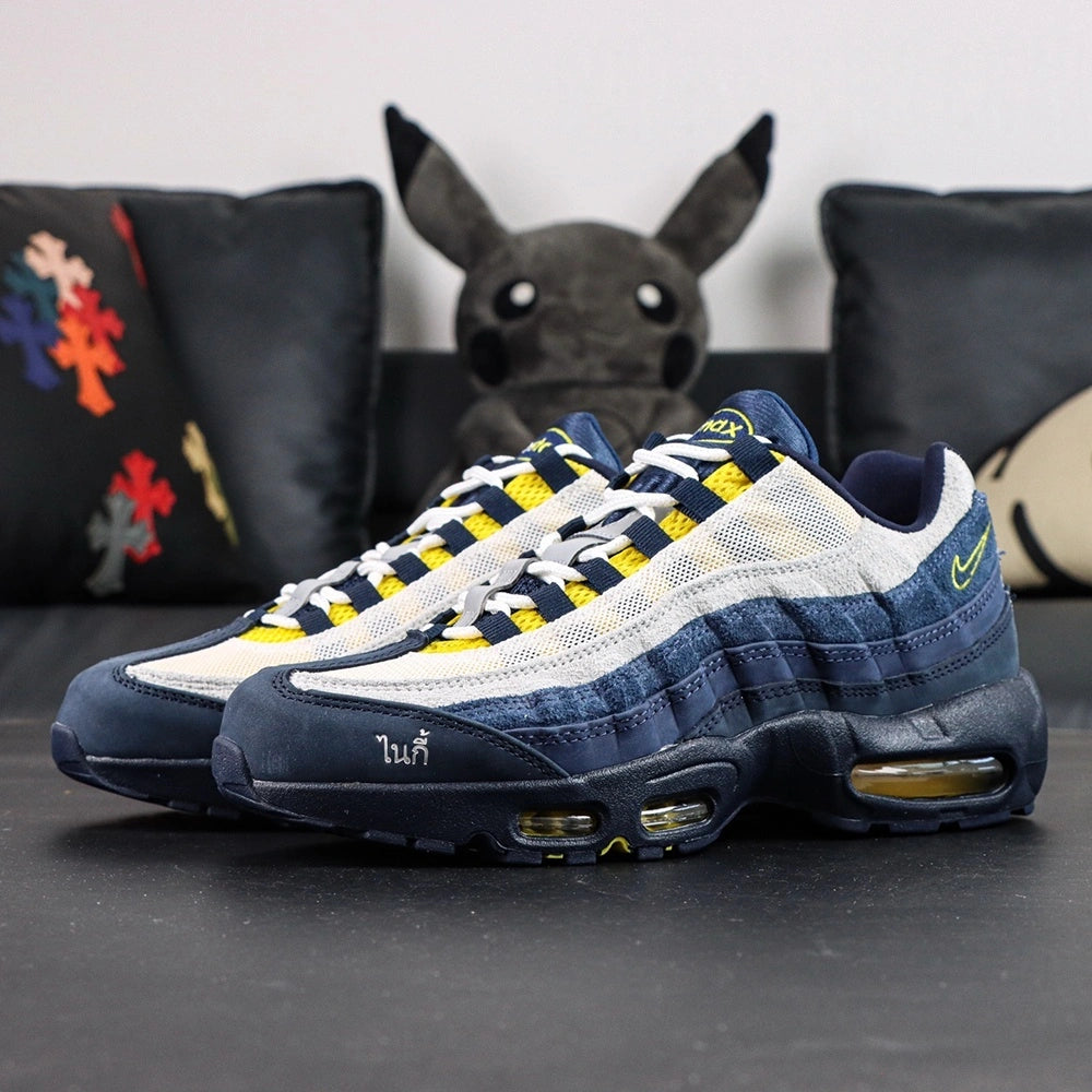 Eric Koston x Nike SB x Air Max 95 Obsidian Speed Yellow 2025 - Forefoot Top Down Close Up Showing Koston Padlock Insole Graphic and Airmax Oval Tongue Badge on Dark Background