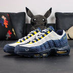 Eric Koston x Nike SB x Air Max 95 Obsidian Speed Yellow 2025 - Forefoot Top Down Close Up Showing Koston Padlock Insole Graphic and Airmax Oval Tongue Badge on Dark Background