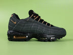 Central Cee x Air Max 95 Live Yours - Full Outsole View Showing Black Waffle Tread and Live Yours Insole Graphic Through Translucent Copper Air Units on Green Background