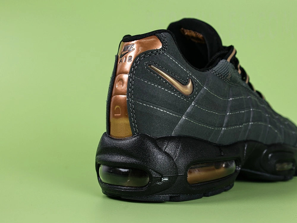Central Cee x Air Max 95 Live Yours - Forefoot Top Down Detail Showing Copper Lace Dubraes and Black Mesh Upper on Green Background