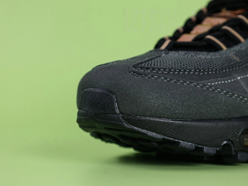 Central Cee x Air Max 95 Live Yours - Tongue Close Up Detail Showing Embroidered Oval Air Max Badge in Copper and White on Black on Green Background