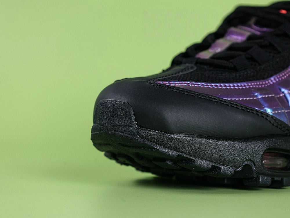 Air Max 95 TT Iridescent - Lateral Heel Spine Close Up on Dark Background Showing Iridescent Purple Blue Teal Chameleon Fabric with Black Embroidered Swoosh