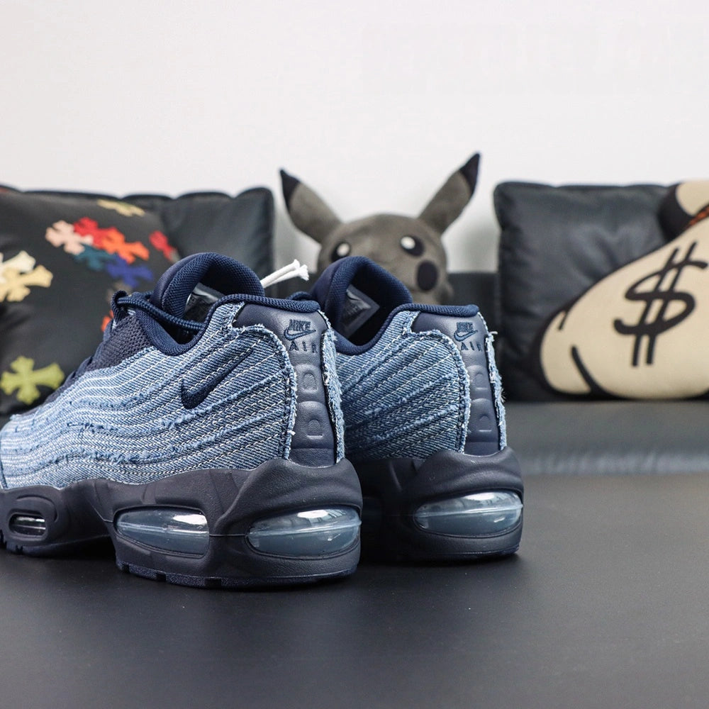 Levis x Air Max 95 OG Obsidian 2025 - Pair Top Down View on Dark Background Showing Oval Airmax Tongue Badge Levis Red Tab Label and White Rope Laces