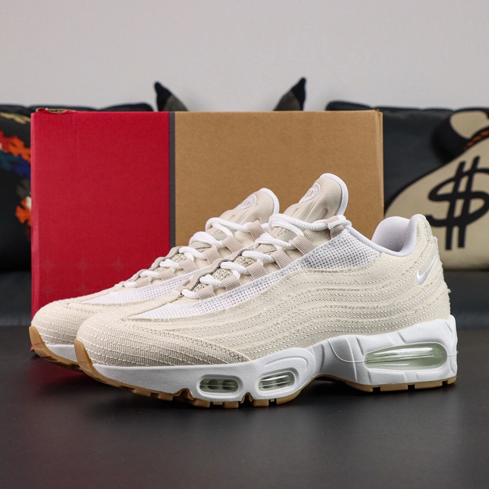 Levis x Air Max 95 OG Light Orewood Brown 2025 - Medial Side View with Pikachu on Sofa Showing Cream Denim Upper Raw Edge Fraying and Mint Air Units