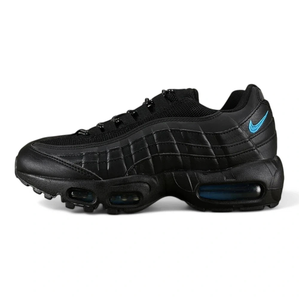 Nike Air Max 95 TT Black Laser Blue DZ4511-001 - Lateral Side View on Olive Background Showing Full Black Leather Upper Tonal Quilted Spine and Laser Blue Swoosh