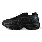 Nike Air Max 95 TT Black Laser Blue DZ4511-001 - Lateral Side View on Olive Background Showing Full Black Leather Upper Tonal Quilted Spine and Laser Blue Swoosh