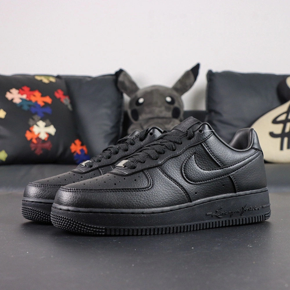 NOCTA x Air Force 1 Low Certified Lover Boy Black - toe box AF1 silver dubrae pair close up